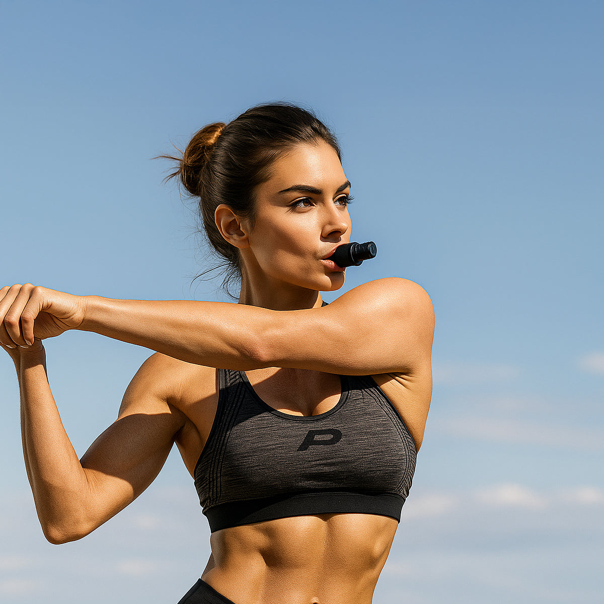 Woman with black gadget for breath trainer for Lung Strength and Cardio Endurance Workouts